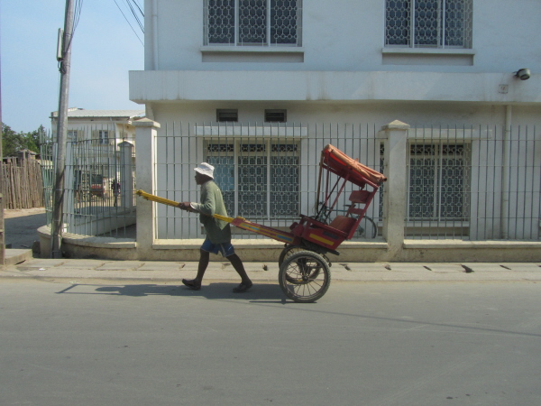 "Pousse-pousse" (hand-pulled rickshaw)