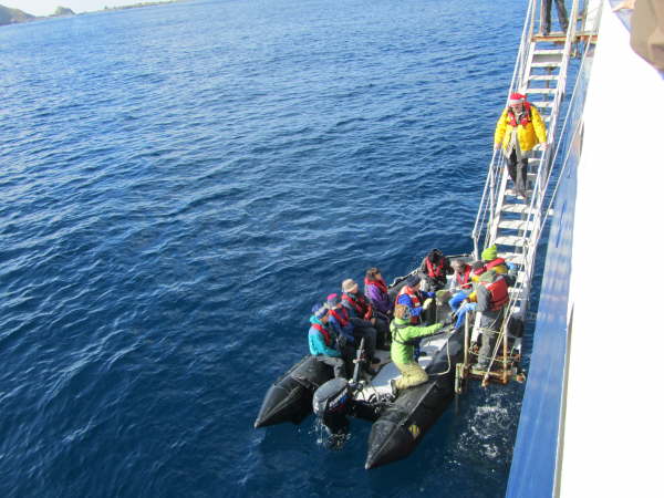 Boarding a zodiac on a calm day
