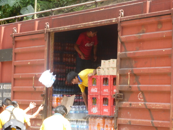 Unloading water from the train in Aguas Calientes
